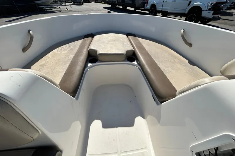 Slide: The Image of 2017 Bayliner Element E16 boat interior with beige seating and cup holders. - 20
