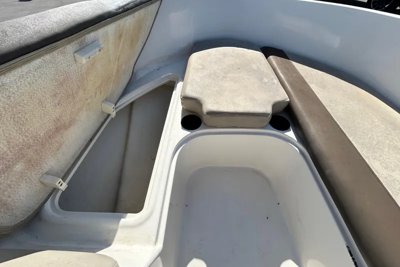 Slide: The Image of 2017 Bayliner Element E16 boat interior with seating and storage compartments. - 21