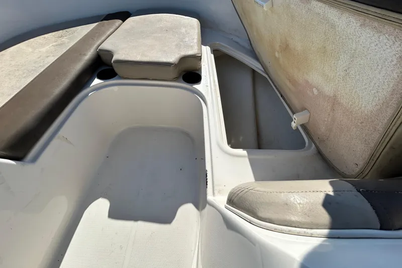 Slide: The Image of 2017 Bayliner Element E16 boat interior with seating and storage compartments. - 22