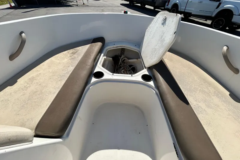Slide: The Image of 2017 Bayliner Element E16 boat interior with open storage compartment and seating. - 23