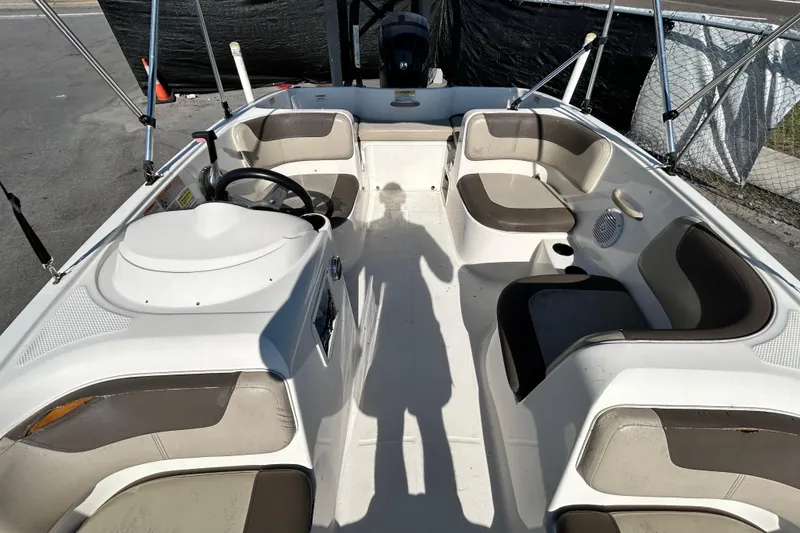 Slide: The Image of 2017 Bayliner Element E16 boat interior with seating and steering wheel. - 27