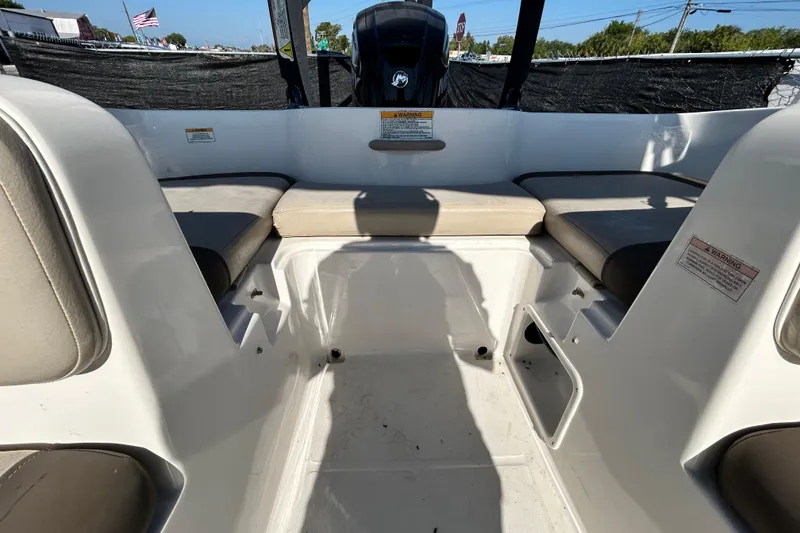 Slide: The Image of 2017 Bayliner Element E16 boat interior with seating and storage compartments. - 32
