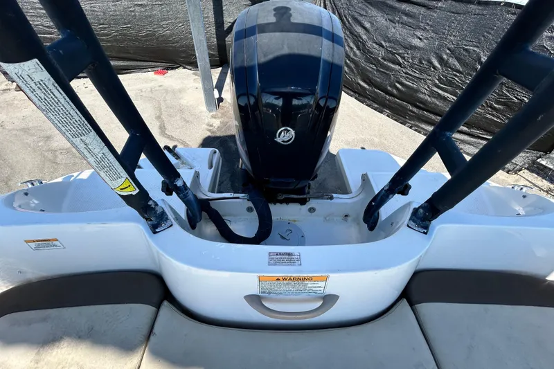 Slide: The Image of 2017 Bayliner Element E16 boat engine and seating area, viewed from above. - 36