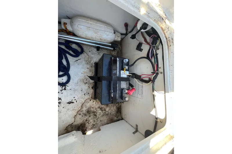Slide: The Image of Battery compartment of a 2017 Bayliner Element E16 boat with wiring and accessories. - 40