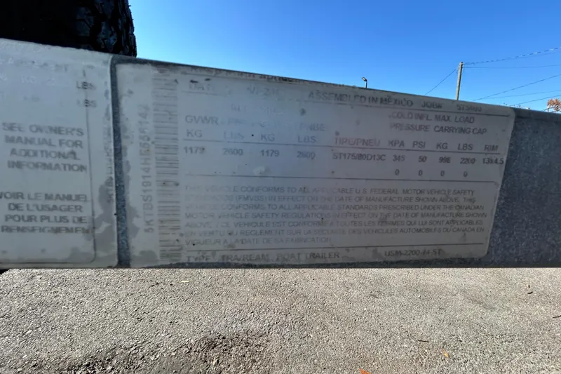 Slide: The Image of 2017 Bayliner Element E16 trailer label with weight and tire specifications. - 44