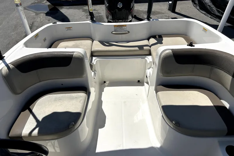Slide: The Image of 2017 Bayliner Element E16 boat interior with cushioned seating and open deck space. - 47