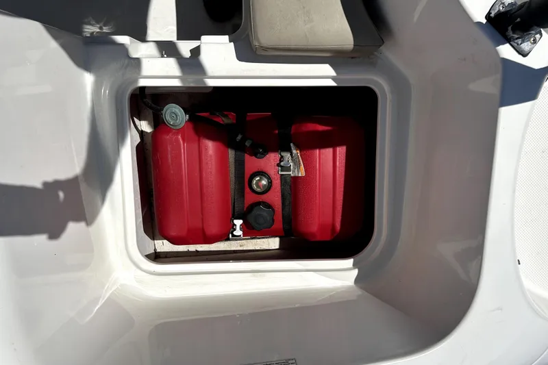 Slide: The Image of Red fuel tank in 2017 Bayliner Element E16 boat compartment. - 49