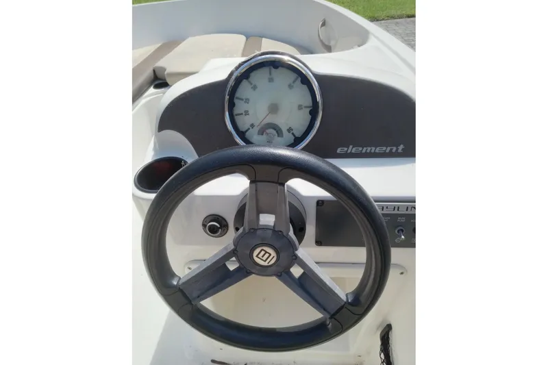Slide: The Image of Steering wheel and dashboard of 2017 Bayliner Element E16 boat. - 6