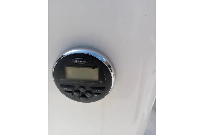 Slide: The Image of Jensen audio system on 2017 Bayliner Element E16 boat dashboard. - 7