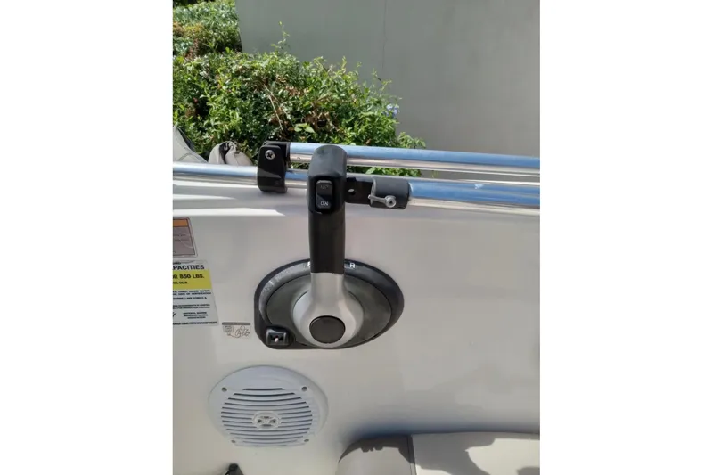 Slide: The Image of 2017 Bayliner Element E16 boat throttle control and speaker detail. - 9