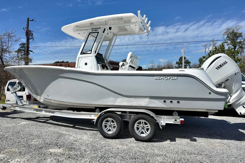 The Image of 2026 Sea Fox 248 Commander boat on trailer, featuring Yamaha engine, parked outdoors. - 0