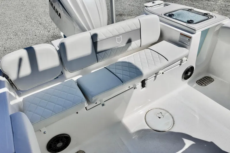 Slide: The Image of 2026 Sea Fox 248 Commander boat interior with cushioned seating and Yamaha engine. - 13
