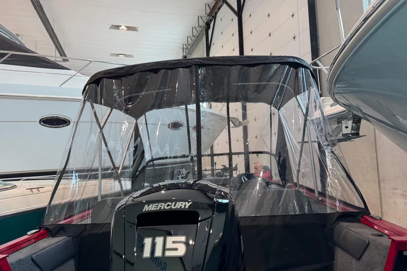 Slide: The Image of 2026 Starweld 18 SXT boat with Mercury 115 engine in a showroom. - 12