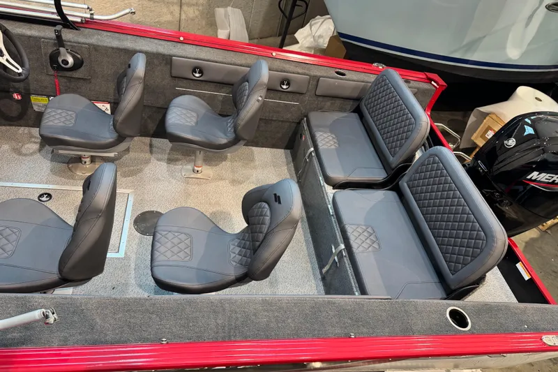 Slide: The Image of Interior of 2026 Starweld 18 SXT boat with gray seating and red accents. - 16