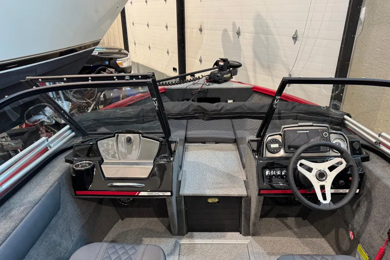 Slide: The Image of Interior view of 2026 Starweld 18 SXT boat cockpit with steering wheel and dashboard controls. - 21