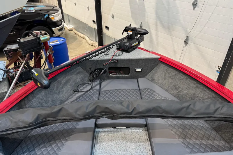 Slide: The Image of 2026 Starweld 18 SXT boat interior with trolling motor and quilted seating. - 24