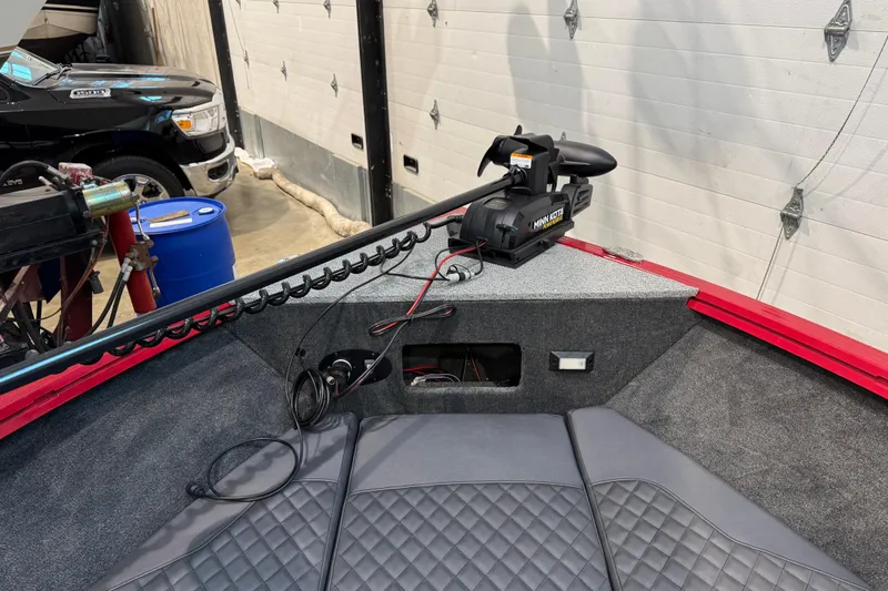 Slide: The Image of 2026 Starweld 18 SXT boat interior with Minn Kota trolling motor and quilted seating. - 25