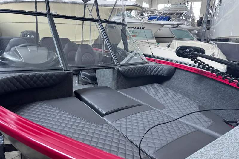 Slide: The Image of 2026 Starweld 18 SXT boat interior with quilted seating and modern design. - 26