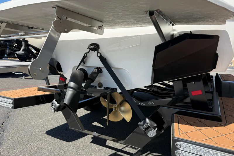 Slide: The Image of Stern view of 2025 MB B52 25 Alpha boat with propeller and trim tabs. - 12