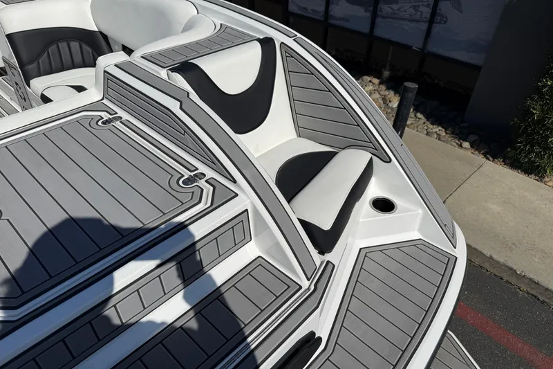 Slide: The Image of 2025 MB B52 25 Alpha boat interior with sleek gray and white seating design. - 14