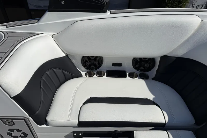 Slide: The Image of Luxury seating in 2025 MB B52 25 Alpha boat, featuring cup holders and speakers. - 22