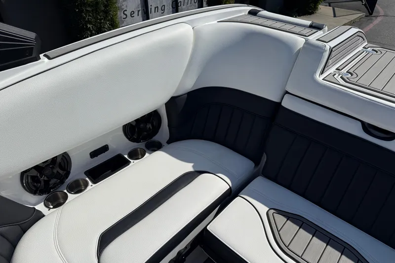 Slide: The Image of Luxurious interior of 2025 MB B52 25 Alpha boat with sleek seating and cup holders. - 23