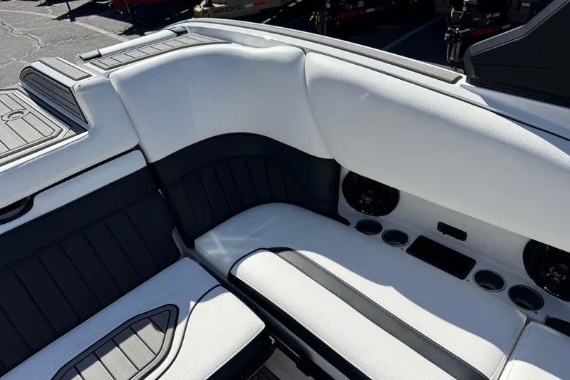 Slide: The Image of Luxurious seating in 2025 MB B52 25 Alpha boat with sleek design and cup holders. - 25
