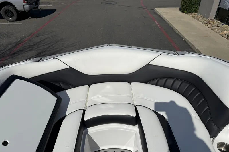 Slide: The Image of Interior of 2025 MB B52 25 Alpha boat with white and black seating. - 32