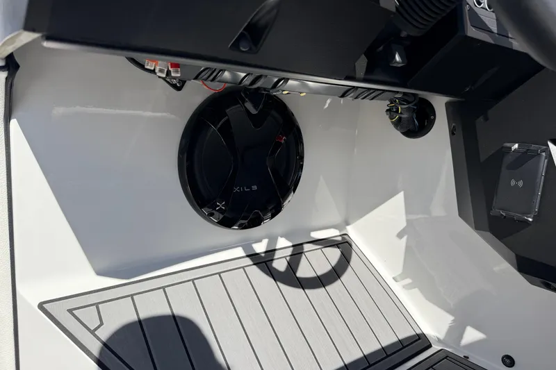 Slide: The Image of Interior of 2025 MB B52 25 Alpha boat featuring speaker and control panel. - 39