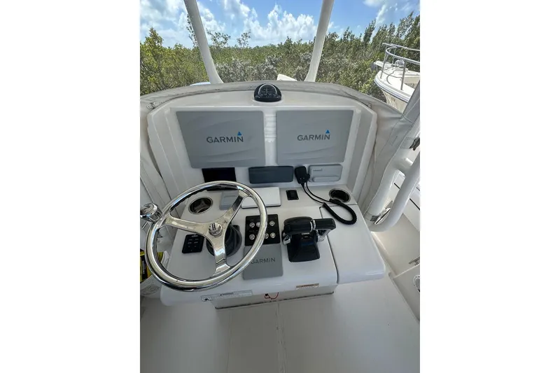 Slide: The Image of Control panel of 2018 Jupiter 26 FS boat with Garmin navigation system. - 11