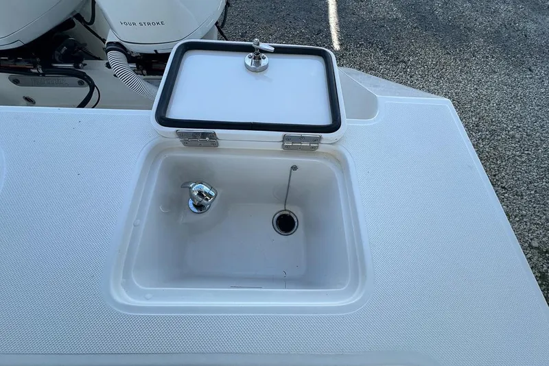 Slide: The Image of 2018 Jupiter 26 FS boat sink with closed lid and faucet. - 17
