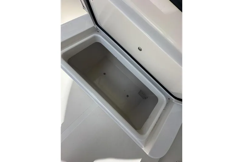 Slide: The Image of Open storage compartment on a 2018 Jupiter 26 FS boat. - 21