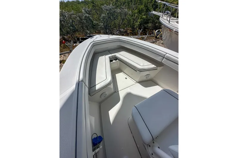 Slide: The Image of 2018 Jupiter 26 FS boat interior with cushioned seating and storage compartments. - 5