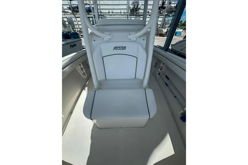 Slide: The Image of 2018 Jupiter 26 FS boat interior with white seating and console. - 8