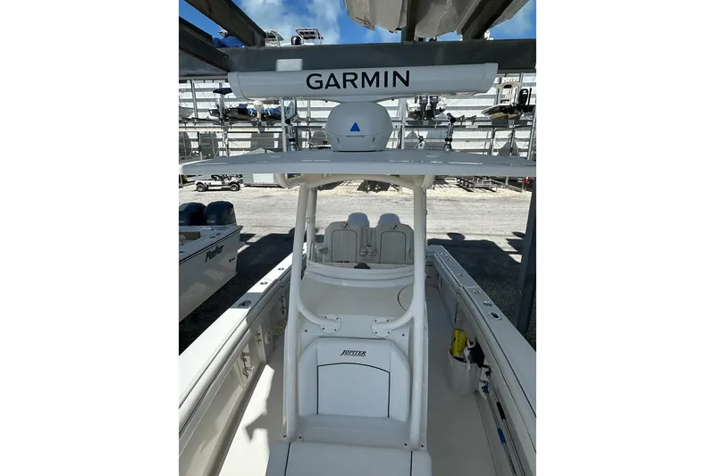 Slide: The Image of 2018 Jupiter 26 FS boat with Garmin equipment, docked in a marina. - 9