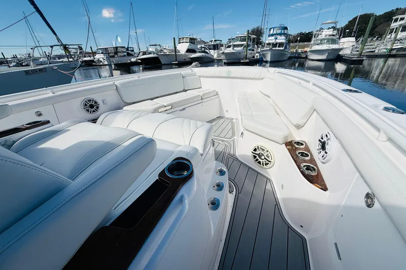 Slide: The Image of Luxurious 2021 Everglades 395 Center Console boat interior at marina. - 11