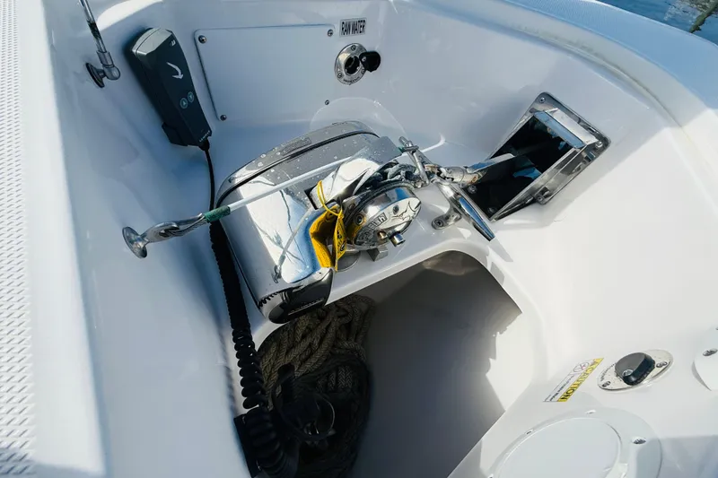 Slide: The Image of 2021 Everglades 395 Center Console boat anchor system with rope and controls. - 14