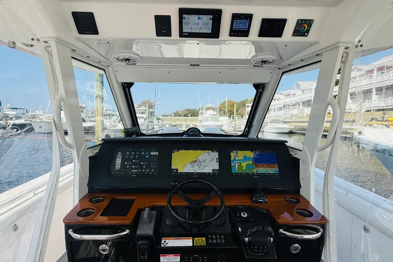 Slide: The Image of Cockpit view of 2021 Everglades 395 Center Console boat with advanced navigation displays. - 23