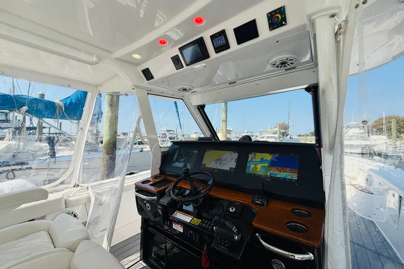 Slide: The Image of Interior view of 2021 Everglades 395 Center Console boat with advanced navigation displays. - 24