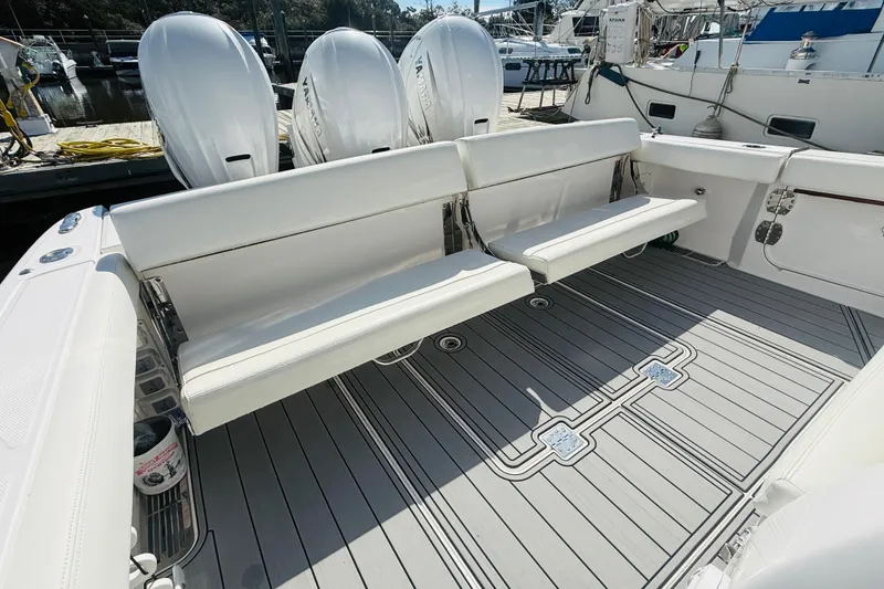Slide: The Image of 2021 Everglades 395 Center Console boat with white seating and Yamaha engines. - 3