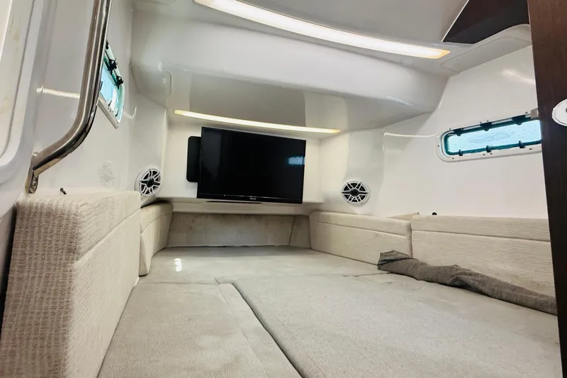 Slide: The Image of Interior cabin of 2021 Everglades 395 Center Console with TV and seating. - 38