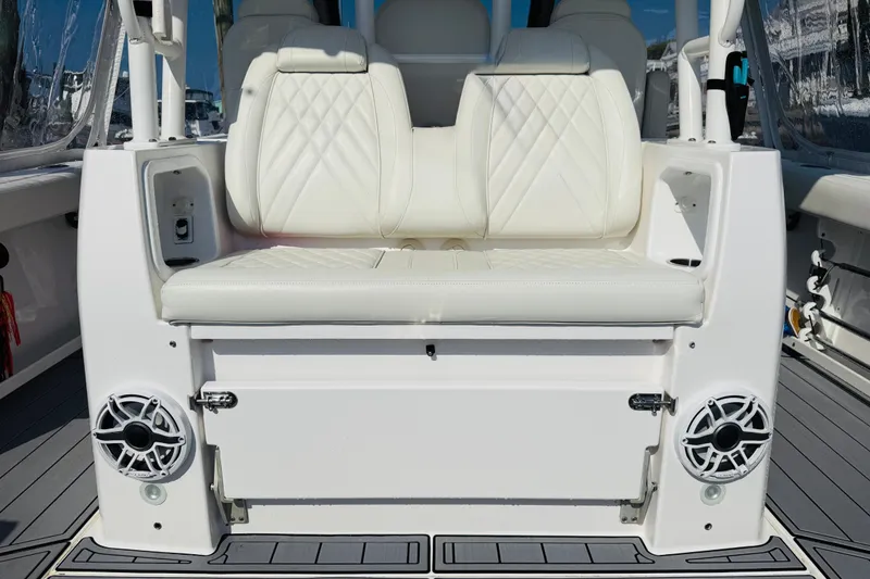Slide: The Image of Luxury seating on 2021 Everglades 395 Center Console boat with integrated speakers. - 42