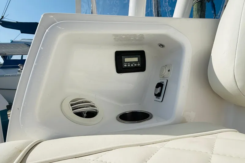 Slide: The Image of Control panel and cup holder on 2021 Everglades 395 Center Console boat. - 45