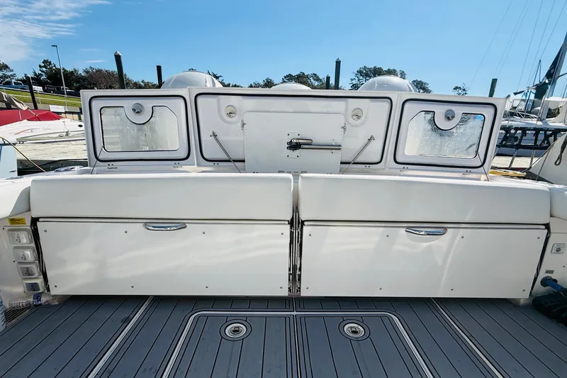 Slide: The Image of 2021 Everglades 395 Center Console boat deck with storage compartments and seating. - 5