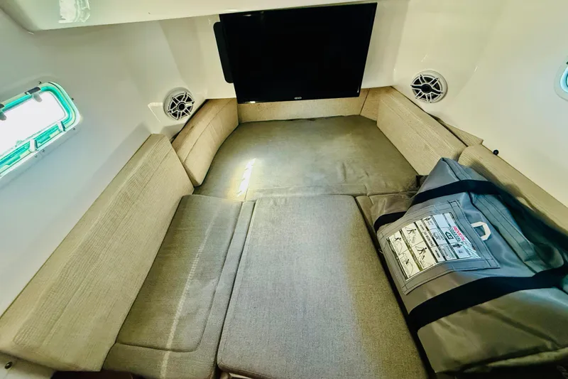Slide: The Image of Interior cabin of 2021 Everglades 395 Center Console with seating and storage. - 7