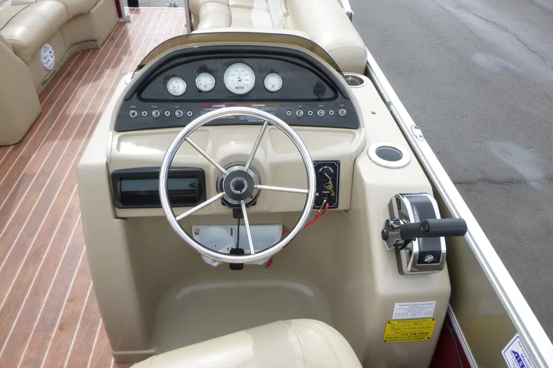 Slide: The Image of Steering console of a 2012 Crest 230SLR Classic boat with gauges and controls. - 10