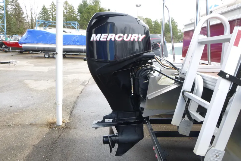Slide: The Image of Mercury outboard motor on 2012 Crest 230SLR Classic boat, parked outdoors. - 12