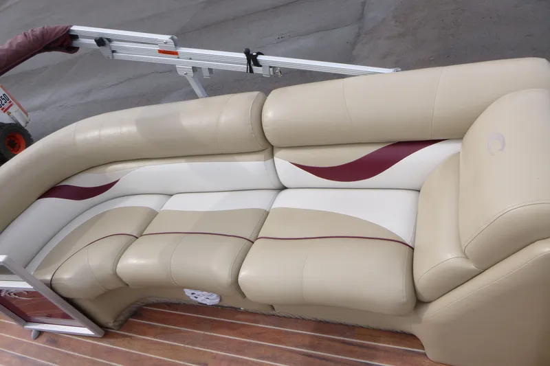 Slide: The Image of Luxurious seating on a 2012 Crest 230SLR Classic boat with beige and maroon accents. - 6