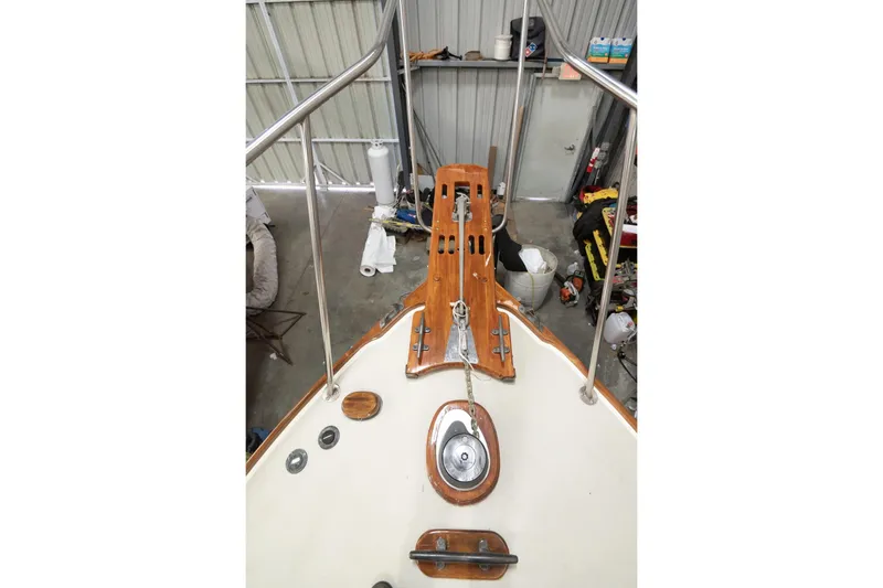 Slide: The Image of 1986 Dyer Hardtop boat deck with anchor chain and wooden fittings in a storage shed. - 22