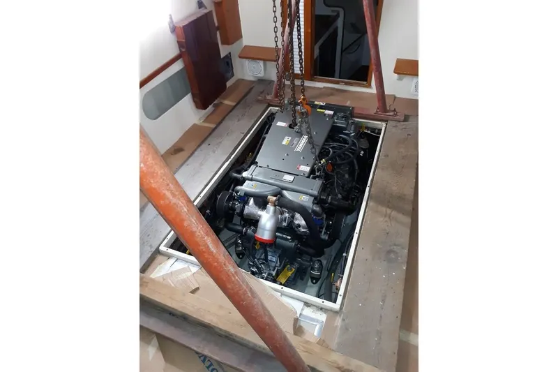 Slide: The Image of Engine installation in 1986 Dyer Hardtop boat, showcasing mechanical setup. - 36